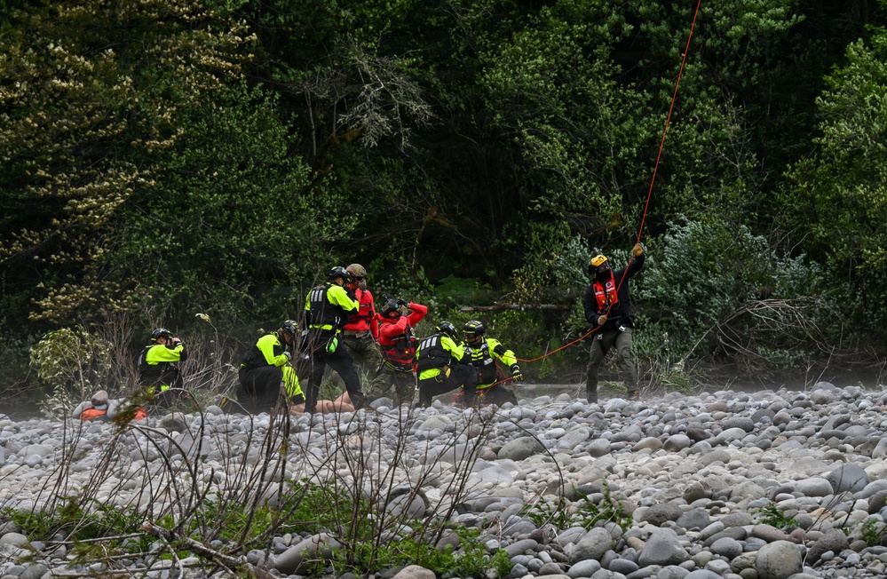 U.S. Coast Guard Air Station Astoria crew works alongside Oregon National Guard, Clackamas County Fire Department and other partner agencies during a full-scale inland water rescue training exercise in Sandy Oregon.