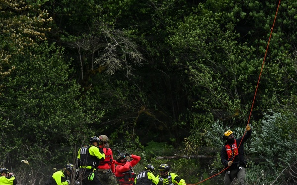 U.S. Coast Guard Air Station Astoria crew works alongside Oregon National Guard, Clackamas County Fire Department and other partner agencies during a full-scale inland water rescue training exercise in Sandy Oregon.