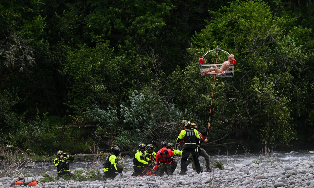 U.S. Coast Guard Air Station Astoria crew works alongside Oregon National Guard, Clackamas County Fire Department and other partner agencies during a full-scale inland water rescue training exercise in Sandy Oregon.