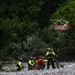 U.S. Coast Guard Air Station Astoria crew works alongside Oregon National Guard, Clackamas County Fire Department and other partner agencies during a full-scale inland water rescue training exercise in Sandy Oregon.