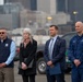 Federal, state, and local agency representatives participate in a media event at Coast Guard Base Seattle.
