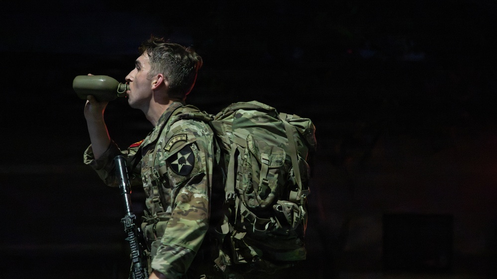 Soldiers Participate in Ruck March During E3B Testing