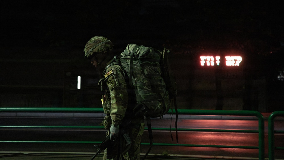 Soldiers Participate in Ruck March During E3B Testing