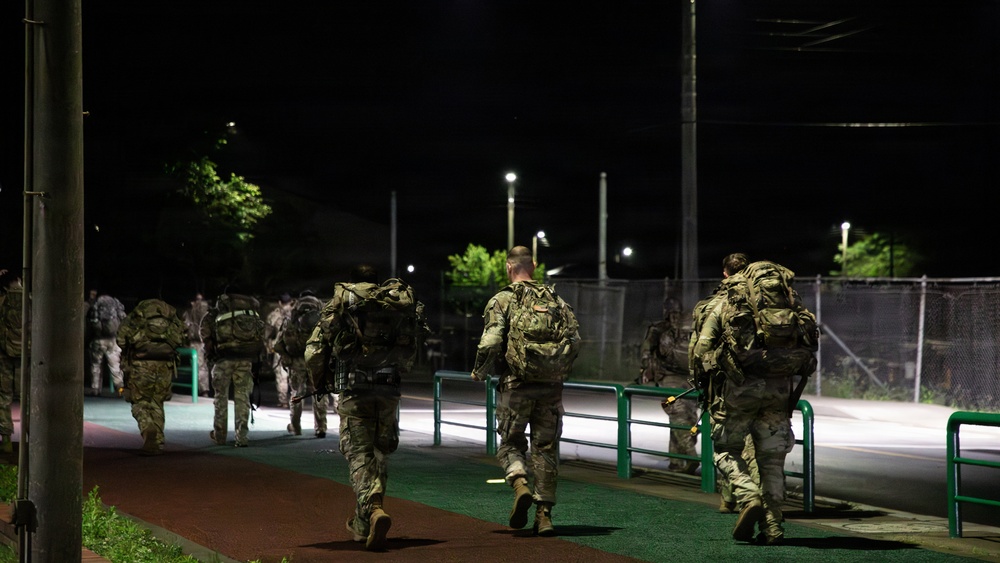 Soldiers Participate in Ruck March During E3B Testing