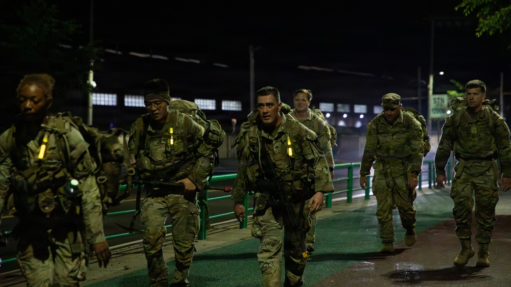 Soldiers Participate in Ruck March During E3B Testing