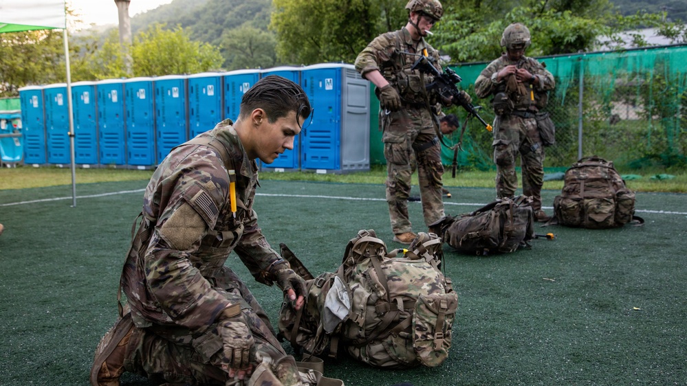Soldiers Participate in Ruck March During E3B Testing