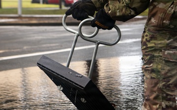 374 CES Airmen maintain installation readiness through storm, mitigating flood