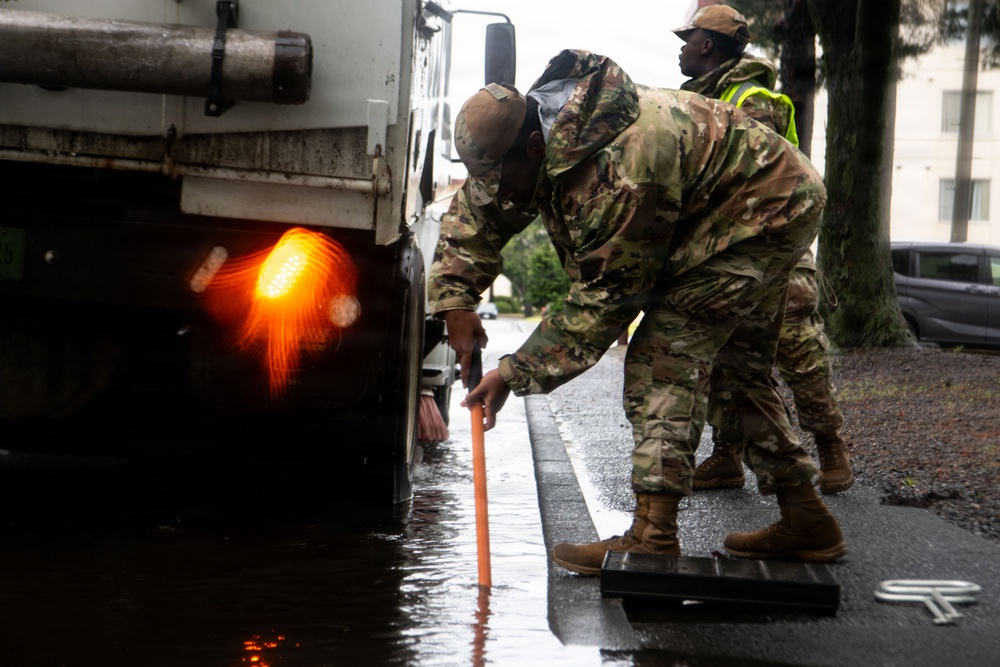 374 CES Airmen maintain installation readiness through storm, mitigating flood