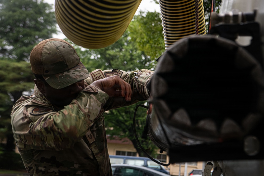 374 CES Airmen maintain installation readiness through storm, mitigating flood
