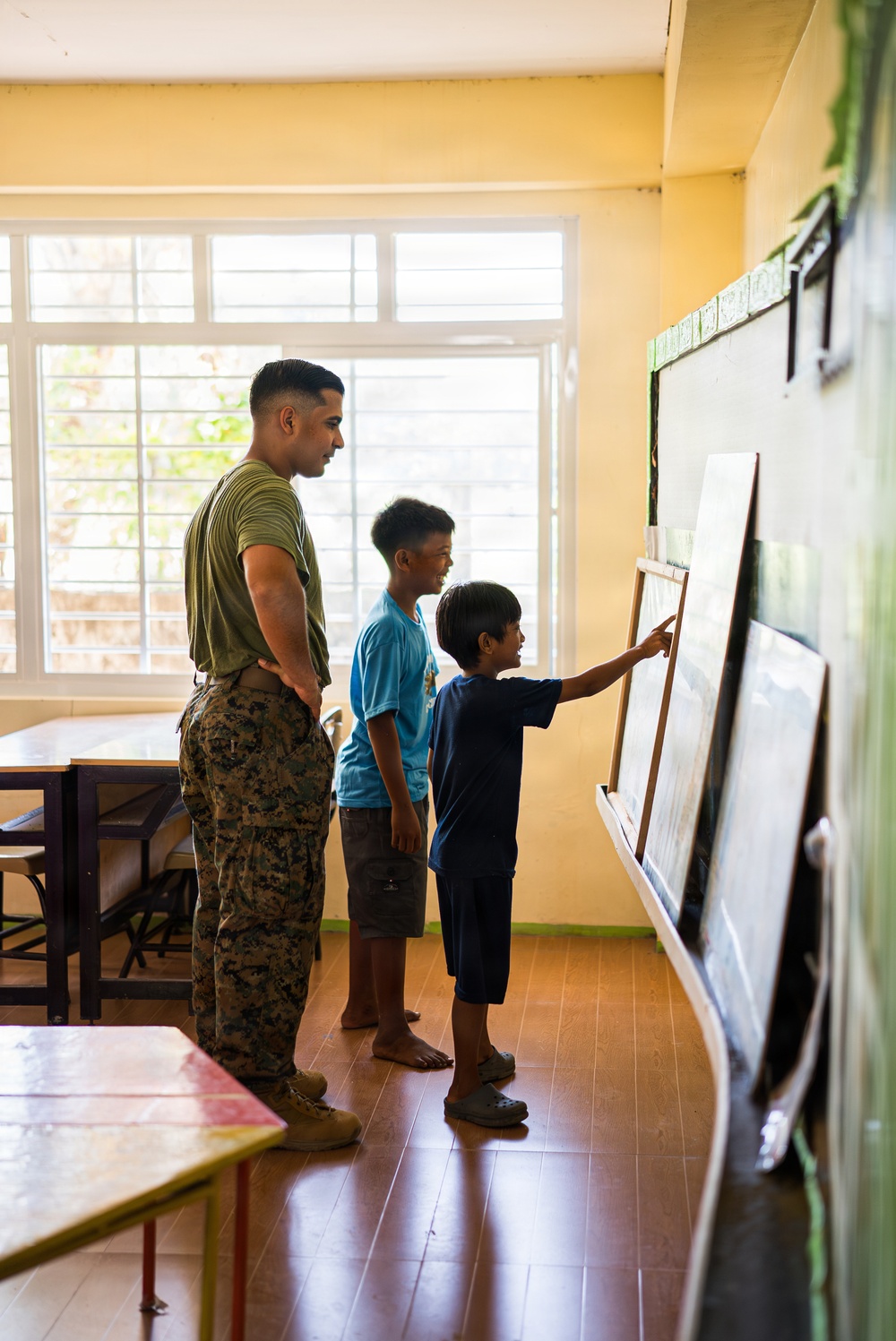 U.S. Marines and Philippine service members participate in Bobon Elementary Eskwela