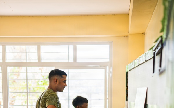 U.S. Marines and Philippine service members participate in Bobon Elementary Eskwela