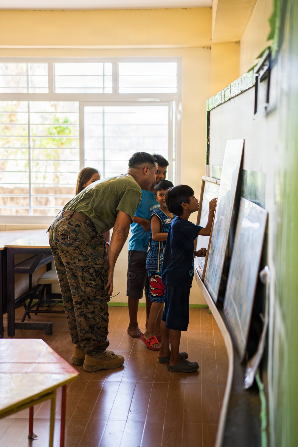 U.S. Marines and Philippine service members participate in Bobon Elementary Eskwela