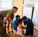 U.S. Marines and Philippine service members participate in Bobon Elementary Eskwela