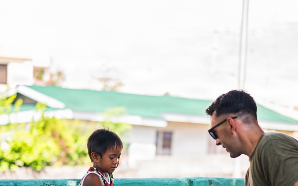U.S. Marines and Philippine service members participate in Bobon Elementary Eskwela