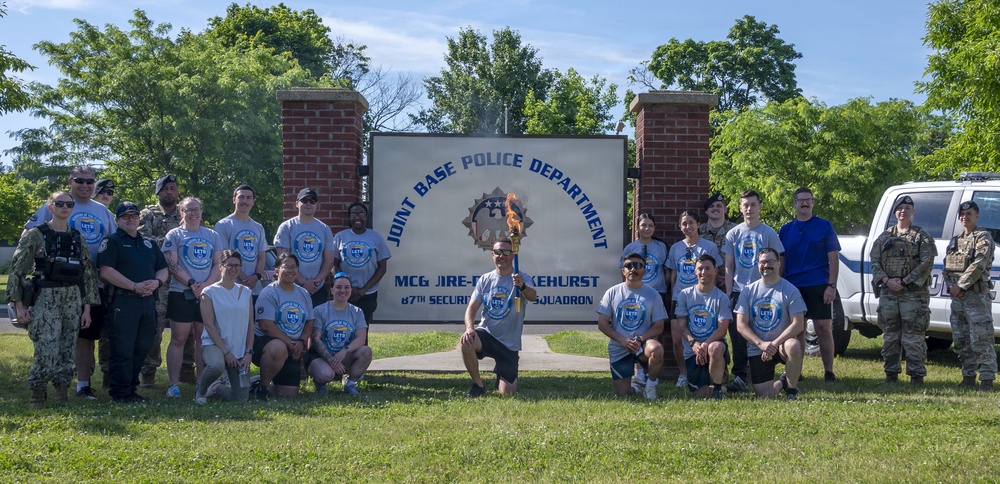 87th Security Forces Squadron carry Flame of Hope
