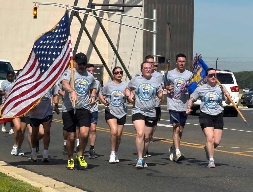 87th Security Forces Squadron carry Flame of Hope
