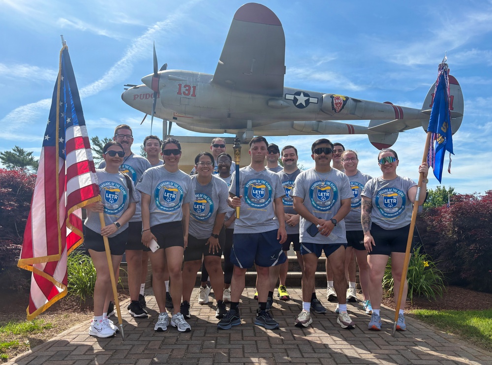 87th Security Forces Squadron carry Flame of Hope