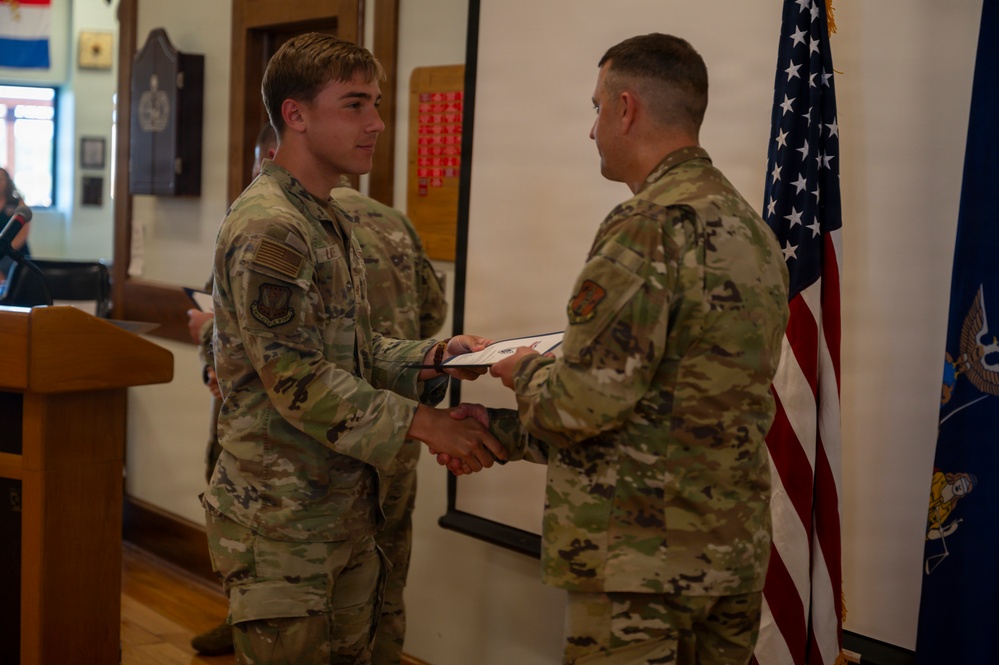 Latessa Shakes Hands With Batick at Induction Ceremony