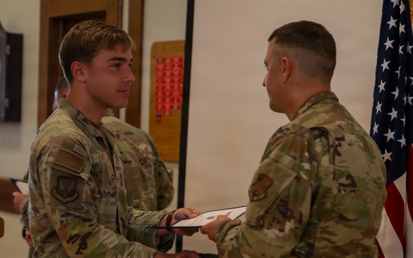 Latessa Shakes Hands With Batick at Induction Ceremony