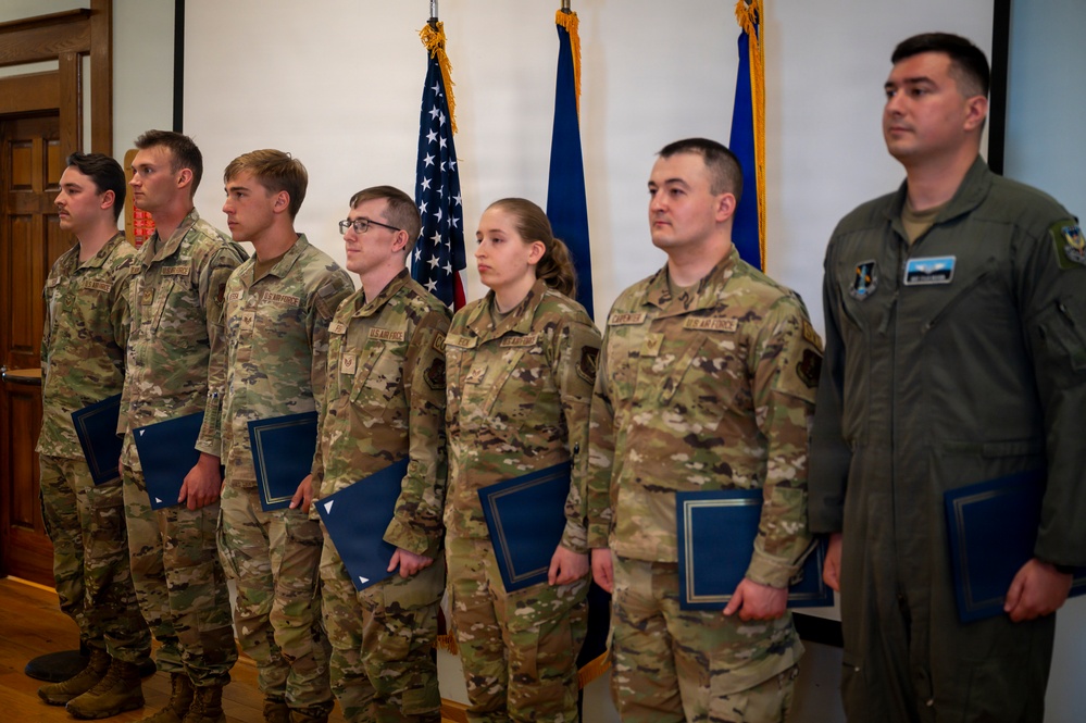 Airmen Stand at Attention at Induction Ceremony