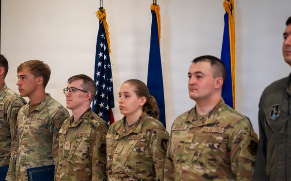 Airmen Stand at Attention at Induction Ceremony