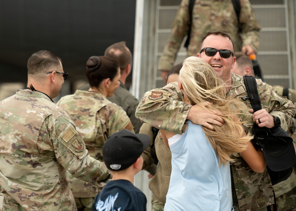 A long-awaited embrace: Air Mobility Command Airmen return to loved ones