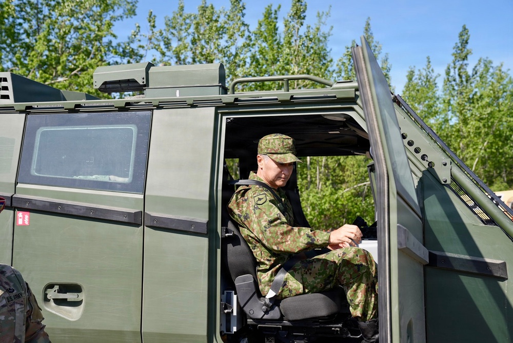 Japanese General Rides Arctic Combat Vehicle during JBER Tour