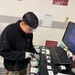 U.S. Navy Hospital Corpsman First Class Gian Molina scans units of blood into an inventory tracking system at the Armed Services Whole Blood Processing Laboratory-East.