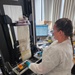U.S. Navy Hospital Corpsman First Class Kristen Gordon Operates a Specialized Sealer for Spray-Dried Plasma Production