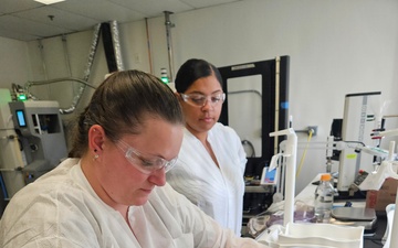 U.S. Navy Hospital Corpsman 1st Class Kristen Gordon and U.S. Air Force Tech. Sgt. Kiersten Zardee Conduct Spray-Dried Plasma Production Training.