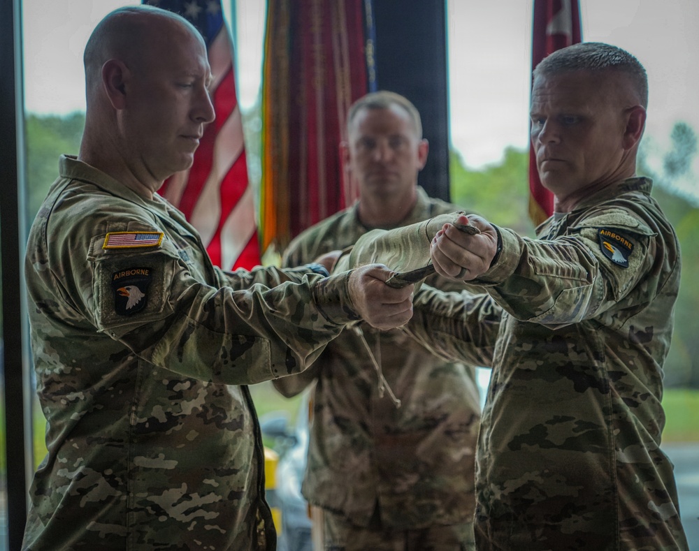 Maj. Gen. David W. Gardner and Command Sgt. Maj. Christopher C. Goodart uncase Division colors