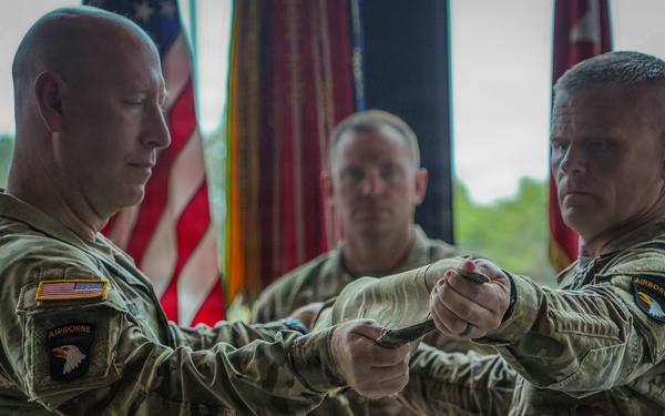 Maj. Gen. David W. Gardner and Command Sgt. Maj. Christopher C. Goodart uncase Division colors