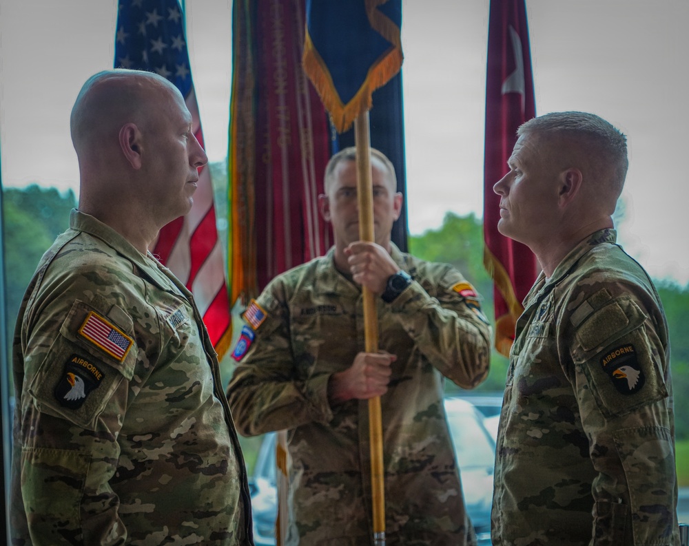Maj. Gen. David W. Gardner and Command Sgt. Maj. Christopher C. Goodart uncase Division colors.