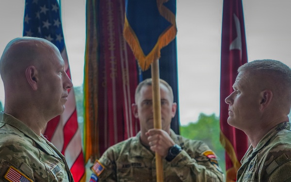 Maj. Gen. David W. Gardner and Command Sgt. Maj. Christopher C. Goodart uncase Division colors.