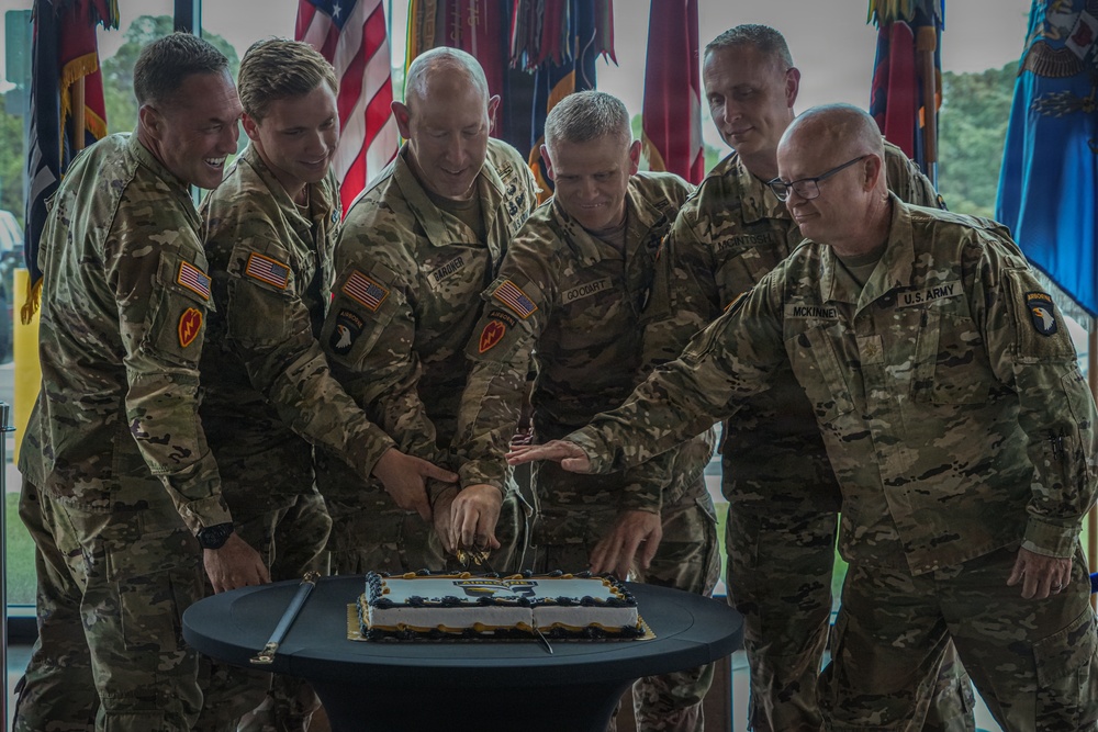Senior leaders of the 101st Airborne Division (Air Assault) participate in the ceremonial cake cutting