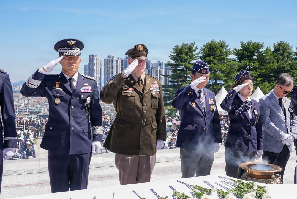 Allies salute together during memorial ceremony tribute