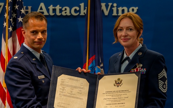 Terry Presents Retirement Certificate to Carroll