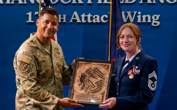 Addison Presents Plaque to Carroll