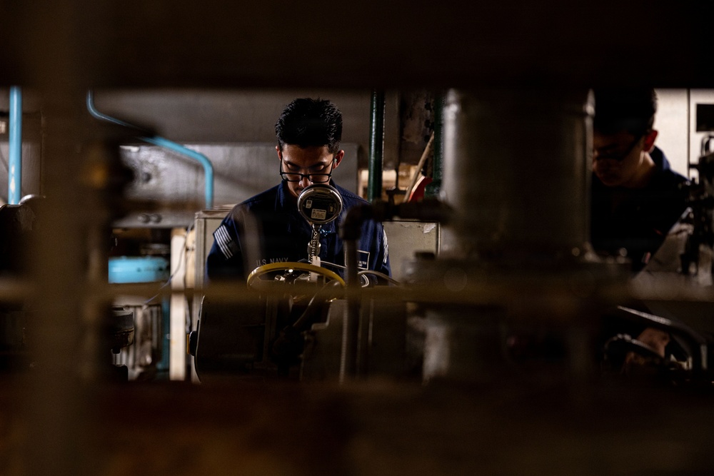U.S. Sailors calibrate equipment