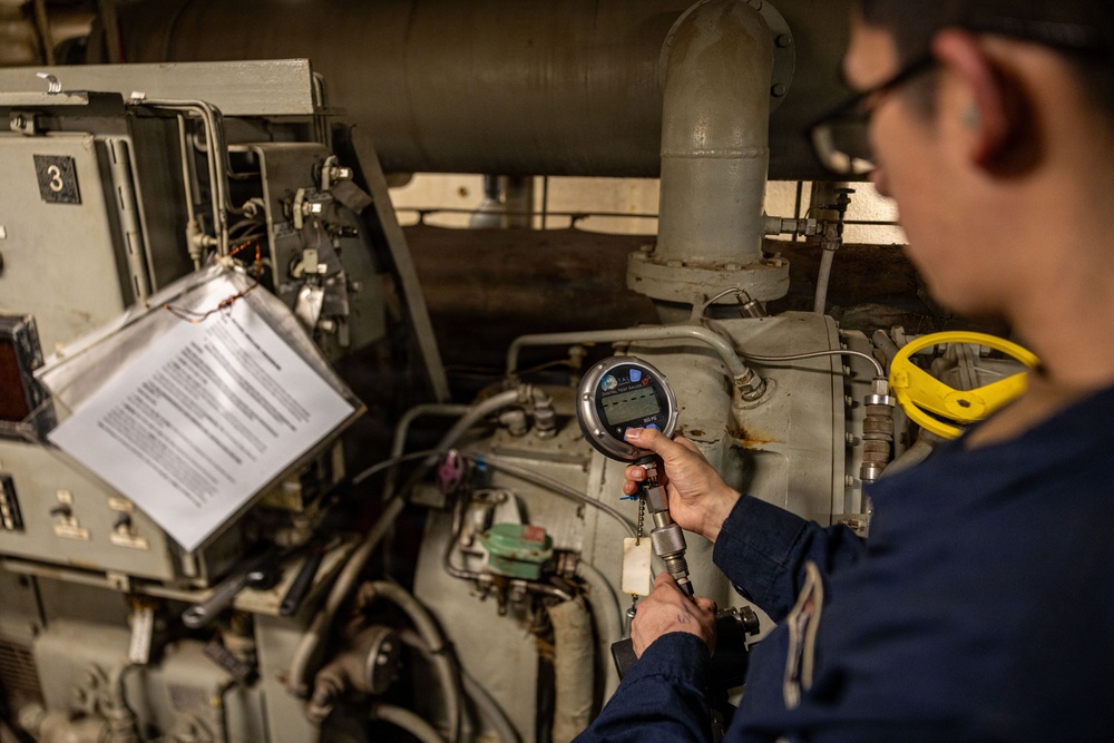 U.S. Sailors calibrate equipment