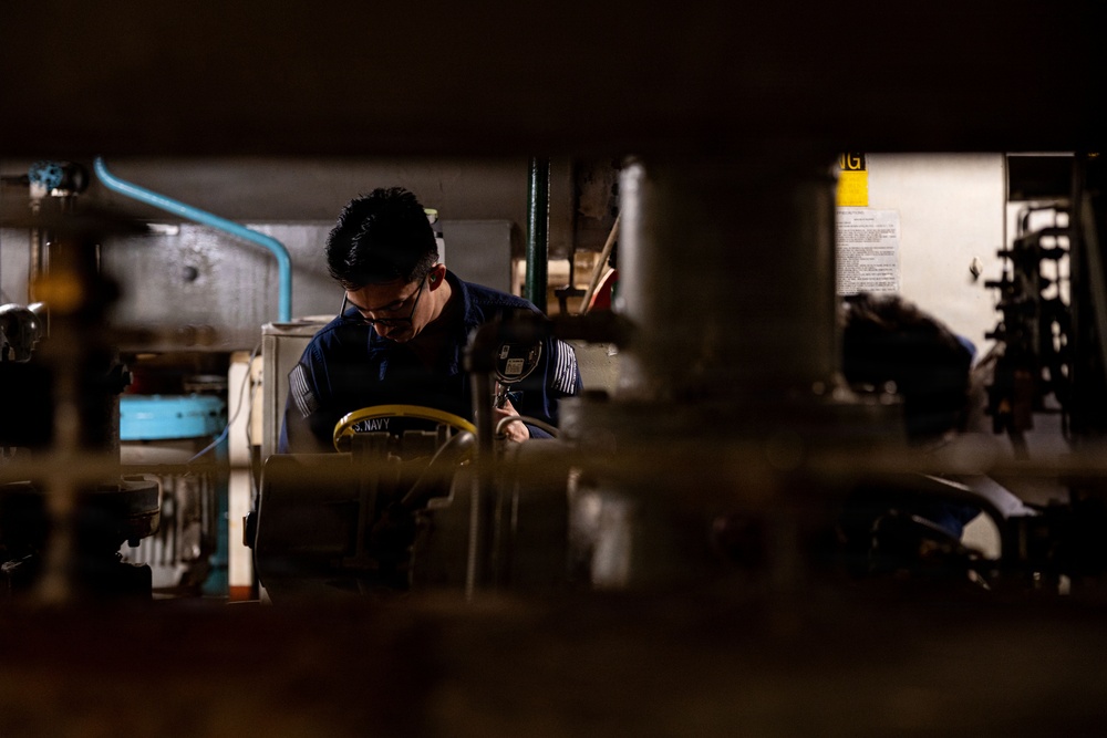 U.S. Sailors calibrate equipment