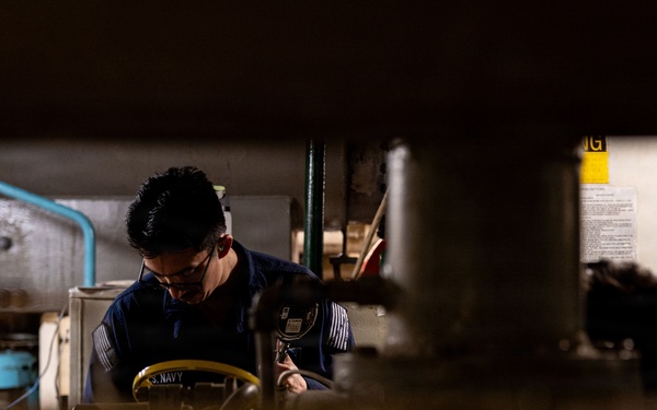 U.S. Sailors calibrate equipment