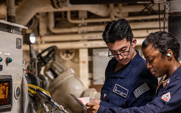 U.S. Sailors calibrate equipment
