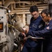 U.S. Sailors calibrate equipment