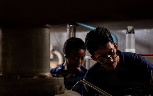 U.S. Sailors calibrate equipment