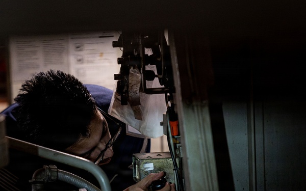 U.S. Sailors calibrate equipment