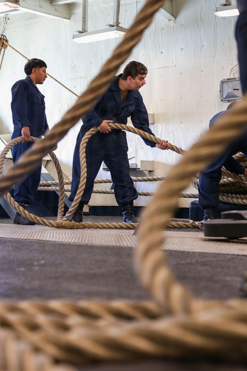U.S. Sailors Heave A Mooring Line During Sea And Anchor Detail