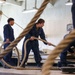 U.S. Sailors Heave A Mooring Line During Sea And Anchor Detail