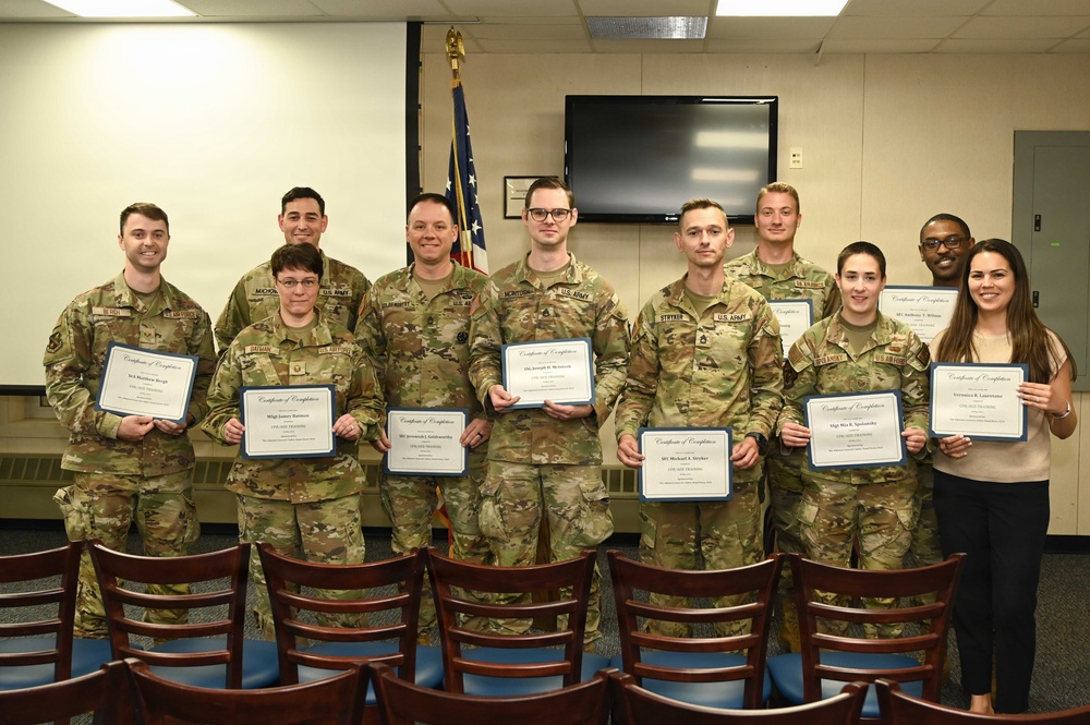Pennsylvania Air National Guard and Pennsylvania National Guard members pose after completing CPR and automated external defibrillator (AED) certification during a TAG Safety Stand Down