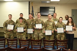 Pennsylvania Air National Guard and Pennsylvania National Guard members pose after completing CPR and automated external defibrillator (AED) certification during a TAG Safety Stand Down